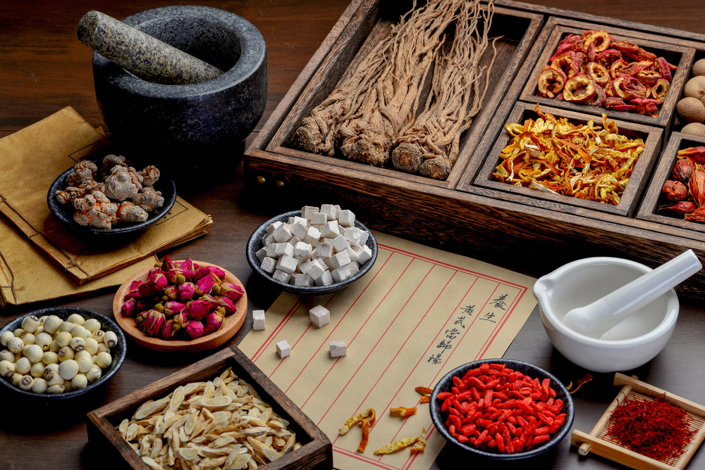 Ancient,Chinese,Medicine,Books,And,Herbs,On,The,Table.english,Translation:health